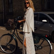 Woman in white blouse and lace skirt