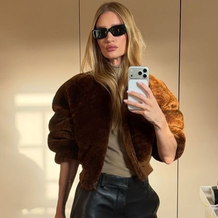 An image of @rosiehw wearing a chic leather pants outfit. 