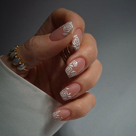 Photo of a white lace nail look