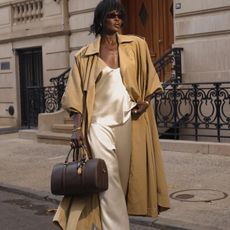 amy lefevre wearing a matching set and trench coat