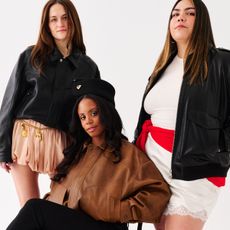 Eliza Huber, Ana Escalante, and Sierra Mayhew wearing leather bomber jackets.