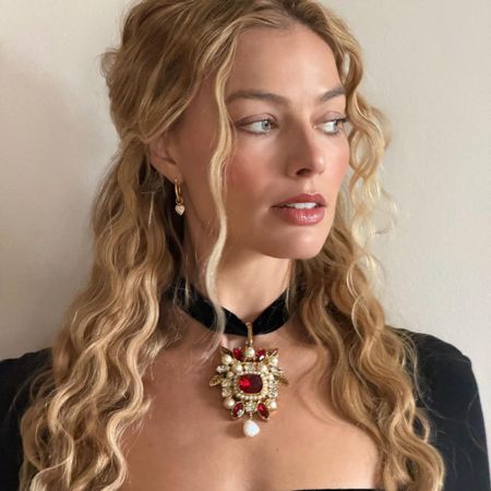 Margot Robbie with blonde wavy hair, styled by Bryce Scarlett
