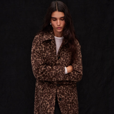 Woman wearing cheetah car coat with white shirt from Madewell.